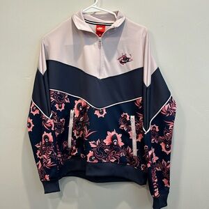 Nike pullover jacket. Size S. Navy and floral pattern.